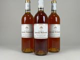 three bottles of wine sitting next to each other on a table