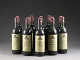 six bottles of wine are lined up in a row on a table