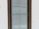 a small display case with a glass door in it
