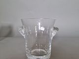 a glass vase that is sitting on a table