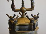 a large metal pot with a gauge on top of it