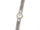 an image of a wrist watch on a white surface with a white background