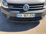 the front view of a grey vw van parked in a parking lot