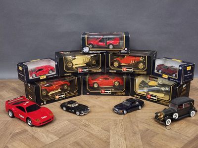 a lot of toy cars that are sitting on a table