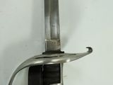 a sword that is hanging on the wall in the room
