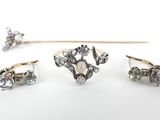 three different types of rings and a stick on a white surface