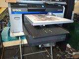 a large printer sitting on top of a table in a room