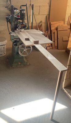 a machine that is sitting in a room with a lot of wood