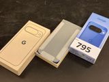 two boxes of google pixel phones sitting next to each other on a table