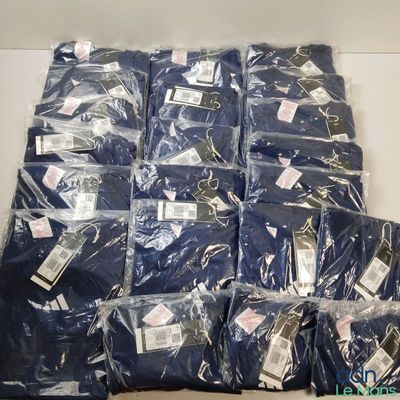 a lot of blue shirts that are on the table