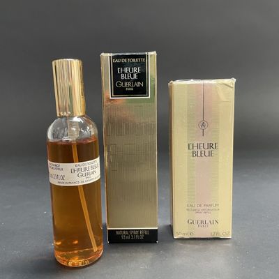 an image of a bottle of perfume next to a box of perfume