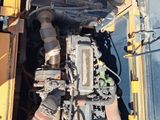 a truck with a large engine sitting in the back of it ' s truck