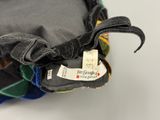 a close up of a pile of clothing with a label on it