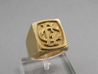 an image of a gold signet ring with the letter c on it