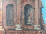 a painting of a building on display on a table