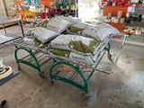 a cart with bags of sand on it in a store