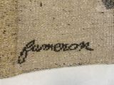 a close up of a piece of burlock fabric with a bird on it