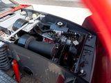 a red car with an engine in the back of it
