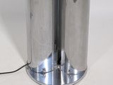 a silver trash can with a cord attached to it