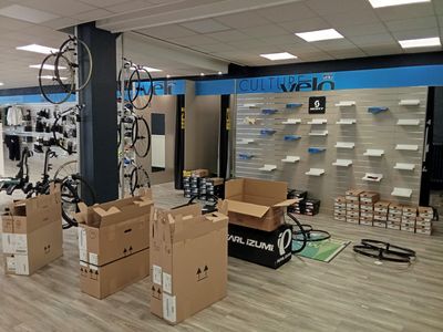 a room with many boxes and bikes in it