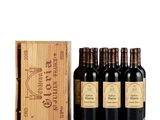 six bottles of red wine in a wooden box with a wooden box