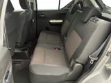 the back seats of a car with a seat belt and a cup holder