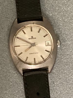 a close up of a wrist watch on a table