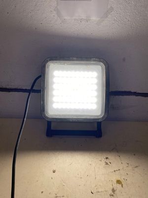 a light that is on in the corner of a room