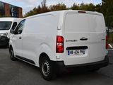 a white van that is parked in a parking lot
