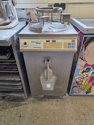 a picture of a commercial kitchen with a sink and a toaster