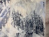 deux œuvres d'art posées sur une table