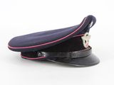 navy blue cap with pink pip on top of it on a white surface