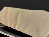a knife that is laying on top of a piece of paper