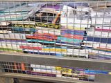 a metal cart with many books on it