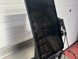 a tablet computer sitting on top of a metal table