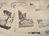 a lot of drawings that are on a table