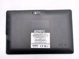 a black tablet with a sticker on it sitting on a table