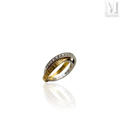 a close up of a ring with diamonds on a white surface