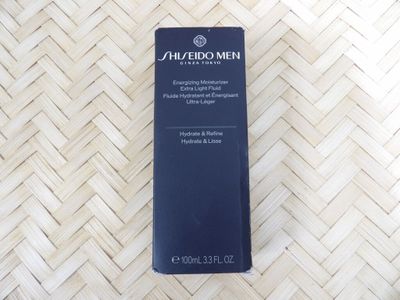 the bottle of shierbo men eye cream is on a bamboo mat