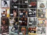 many different cd ' s on the wall of this room