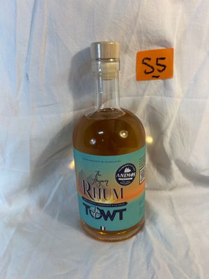 a bottle of liquid that is sitting on a table