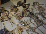 many different types of weapons on display on the floor