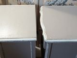 pair of grey painted nightstands with white trim and drawers