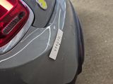a close up of a car with a sticker on it ' s tail light