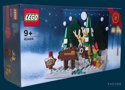 une boîte de Lego sur laquelle est représentée une scène de Noël