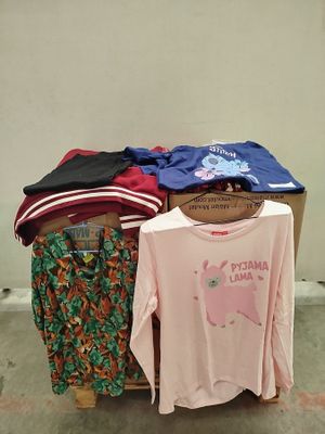 a pile of clothing that is sitting on a table