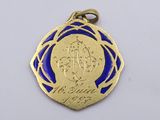 a close up of a medal on a white surface with a blue background