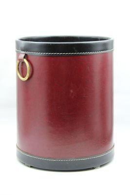 a black and red container with a gold ring on it
