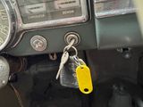 a car dashboard with a bunch of keys on it