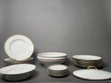 many plates and bowls sitting on a table